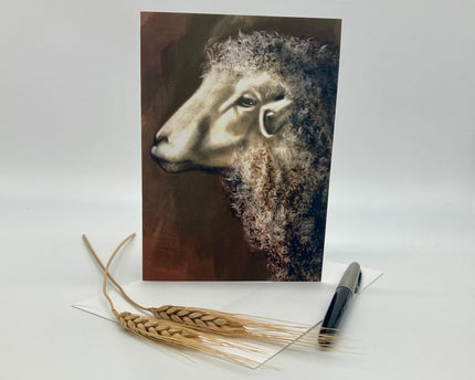 Greeting card with a sheep illustration on a white background with wheat and a pen.