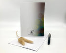 Greeting card with decorative elements on a white surface