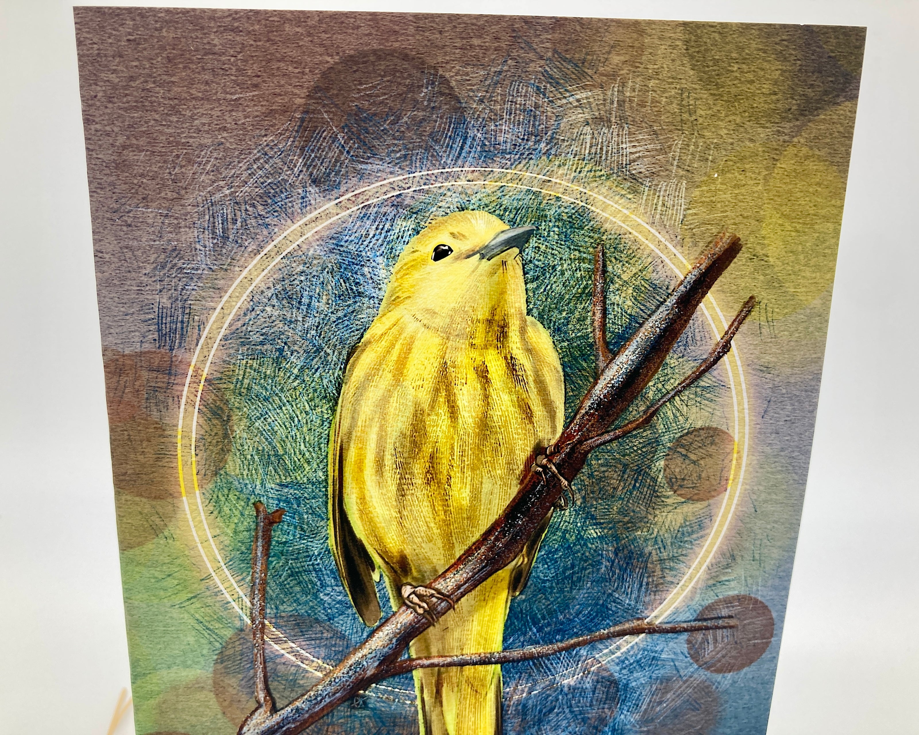 Yellow bird on a branch with a textured circular background