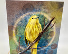 Yellow bird on a branch with a textured circular background