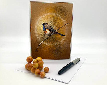 Decorative card with a bird illustration on a branch, next to berries and a pen on a white background