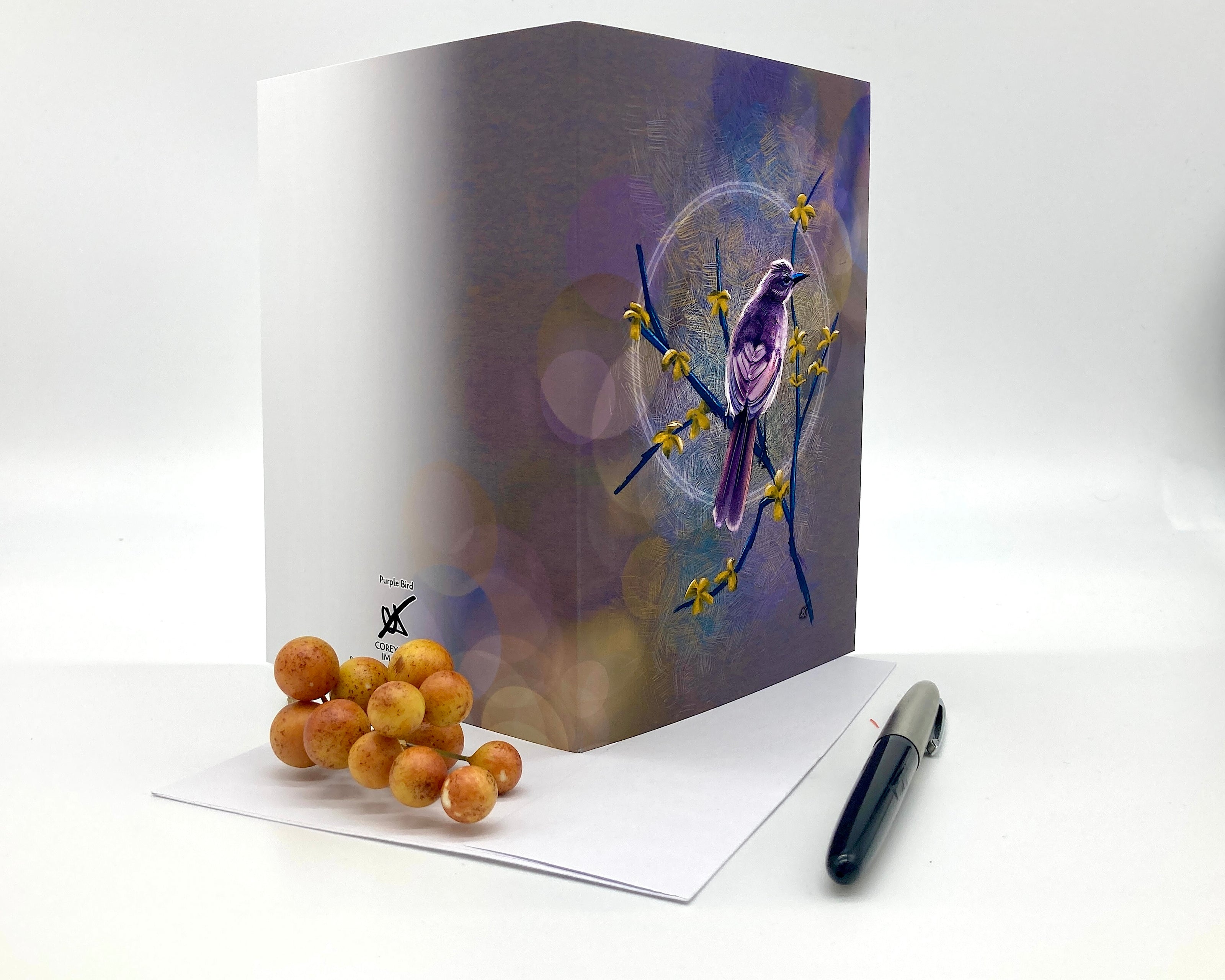 Open greeting card with a bird design on a white background