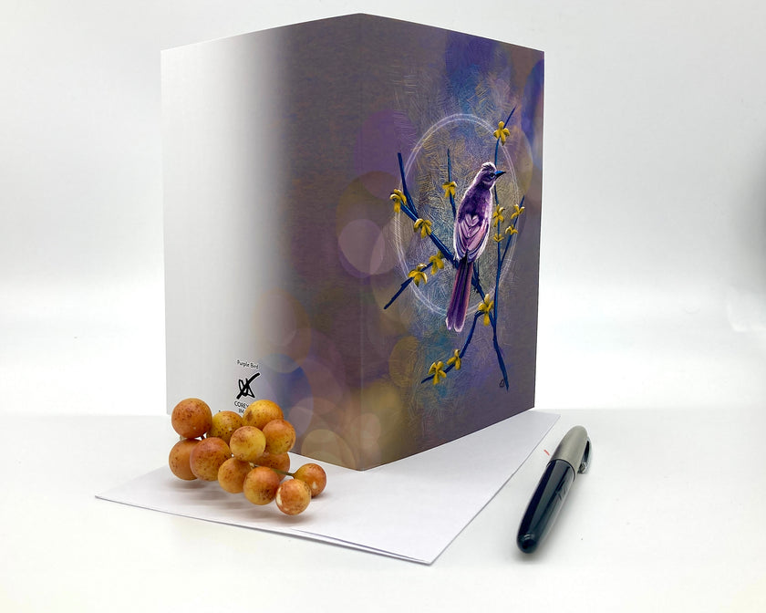 Open greeting card with a bird design on a white background