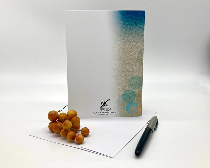 Back of a greeting card with a pen and fruit on a white background