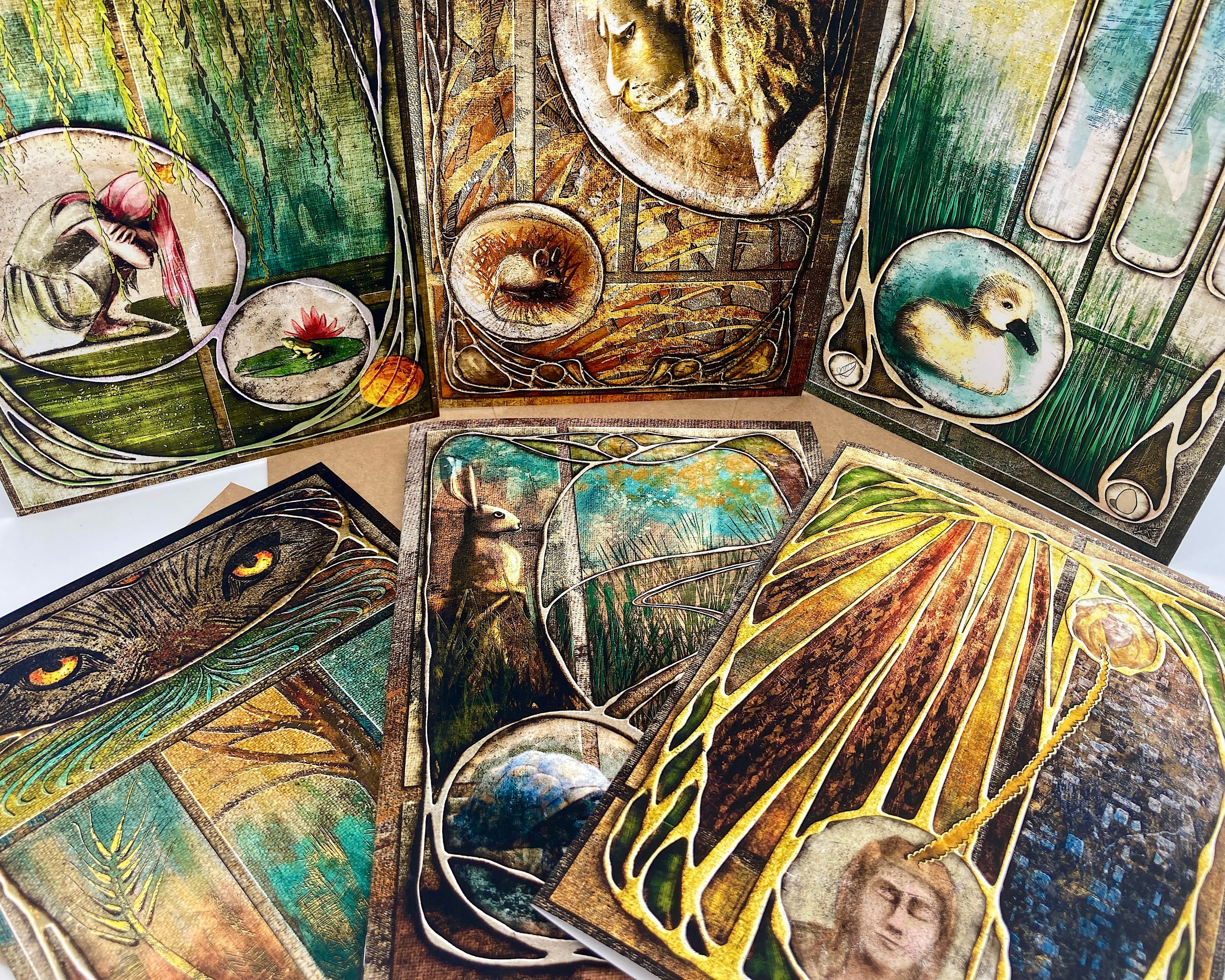 Collection of intricately designed cards with various illustrations on a white background