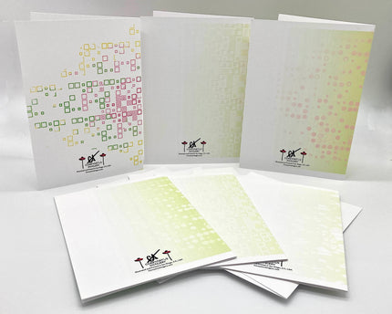 Backside of six greeting cards with geometric designs and branding on a white background