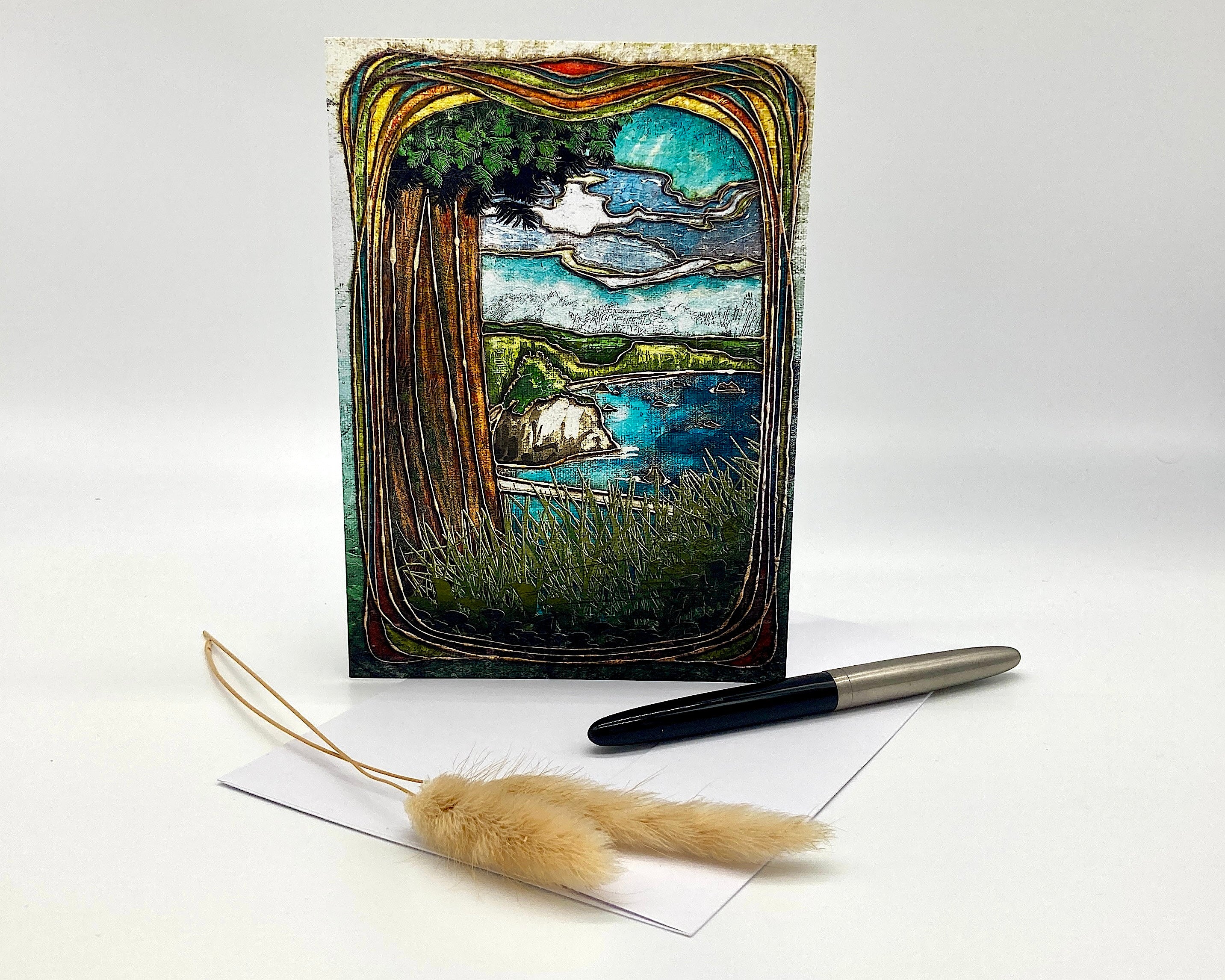 Decorative greeting card with nature-themed illustration, pen, and feather on a white background