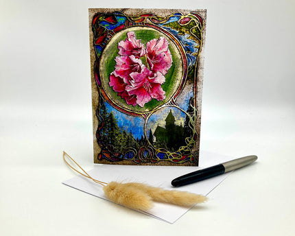 Decorative greeting card with floral design and pen on a white background