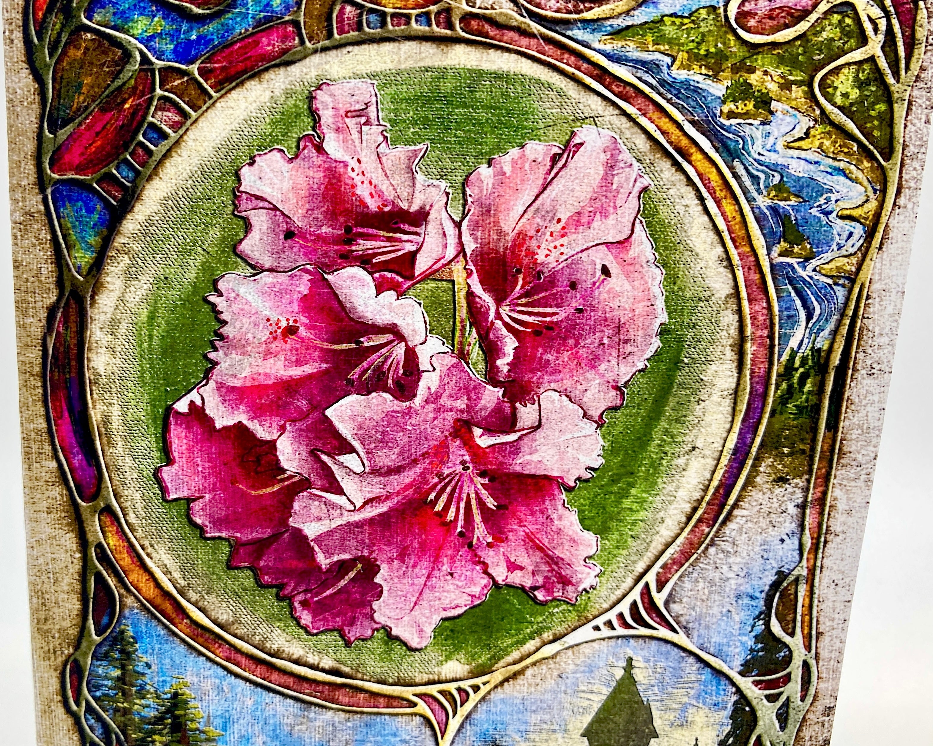 Decorative artwork with pink flowers in a circular frame surrounded by colorful floral patterns.