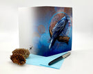Greeting card with a blue bird design on a white background