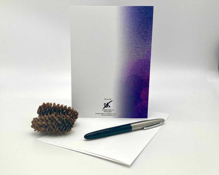 Greeting card with purple gradient, pen, and pine cone on a white background