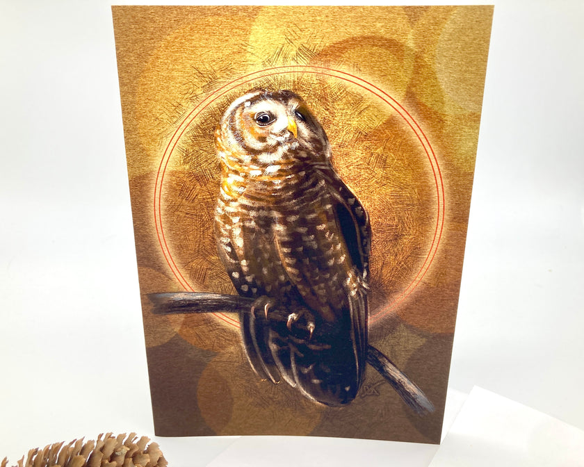 Card with an owl design on a gold background