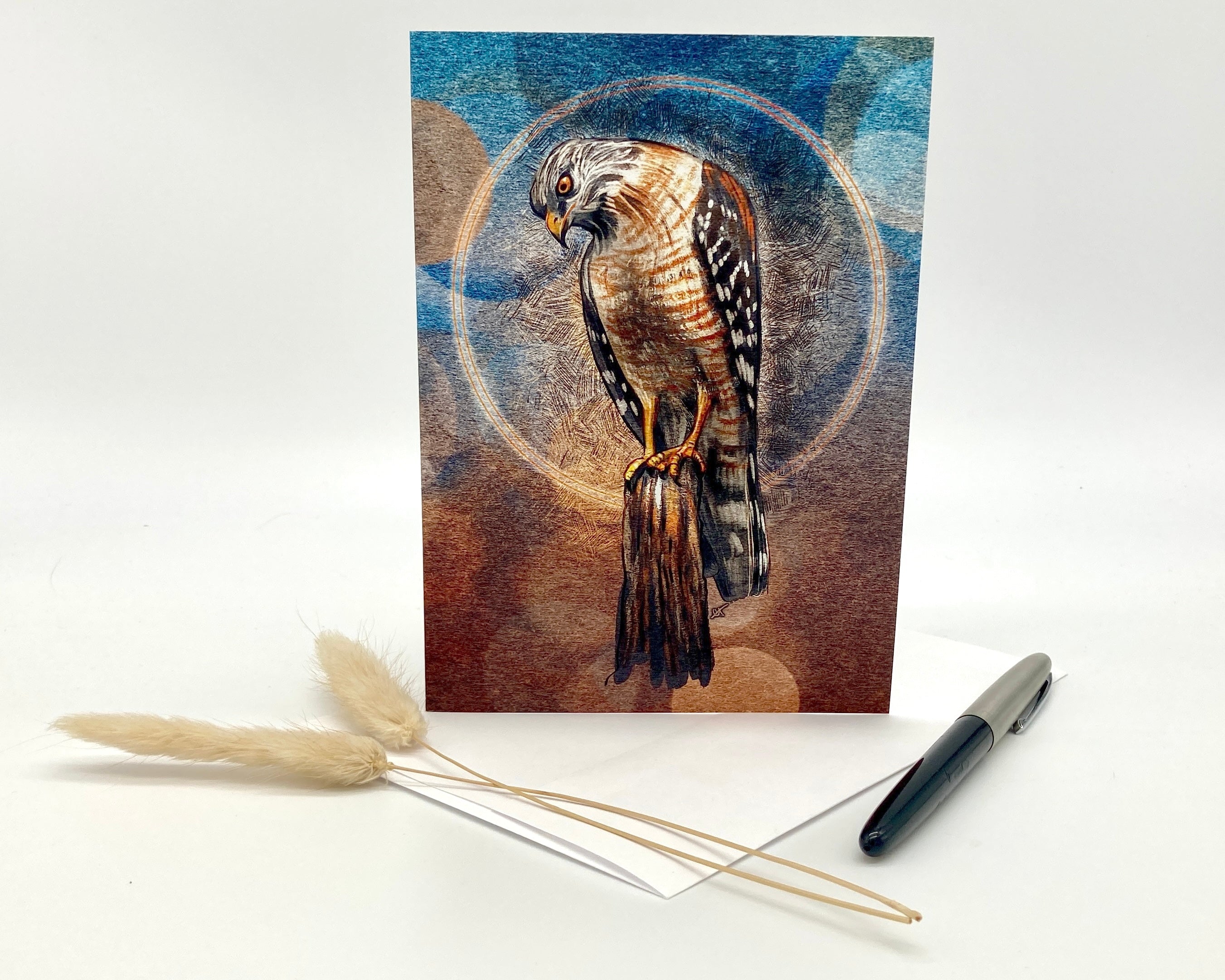 Card with a hawk illustration on a white background with decorative elements.