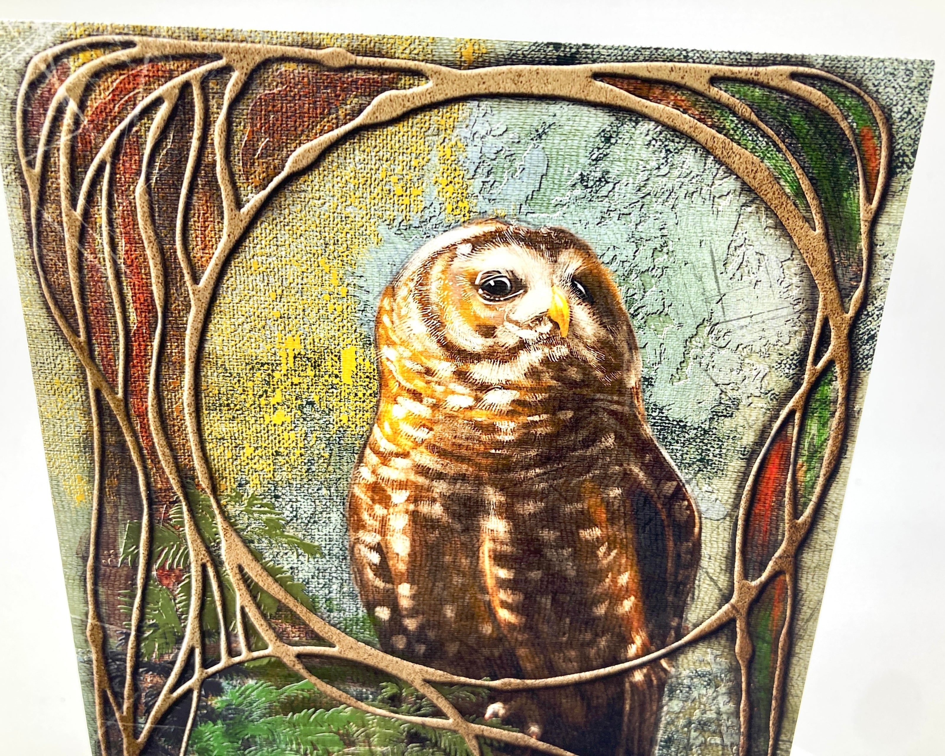 Artistic depiction of an owl surrounded by nature-themed elements