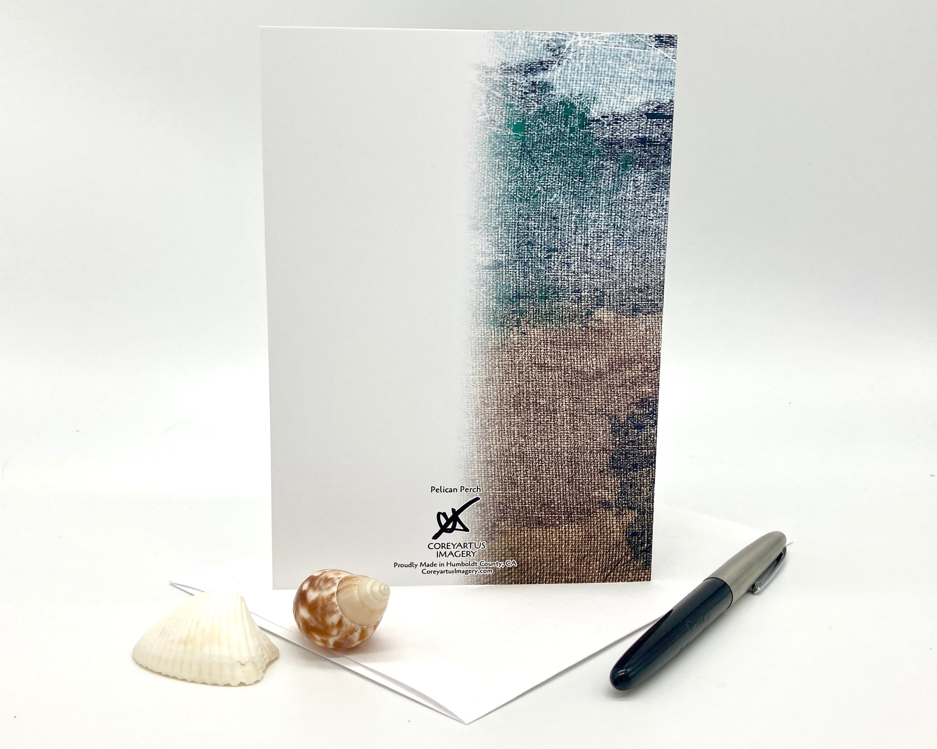 Greeting card with beach design and shell on a white background