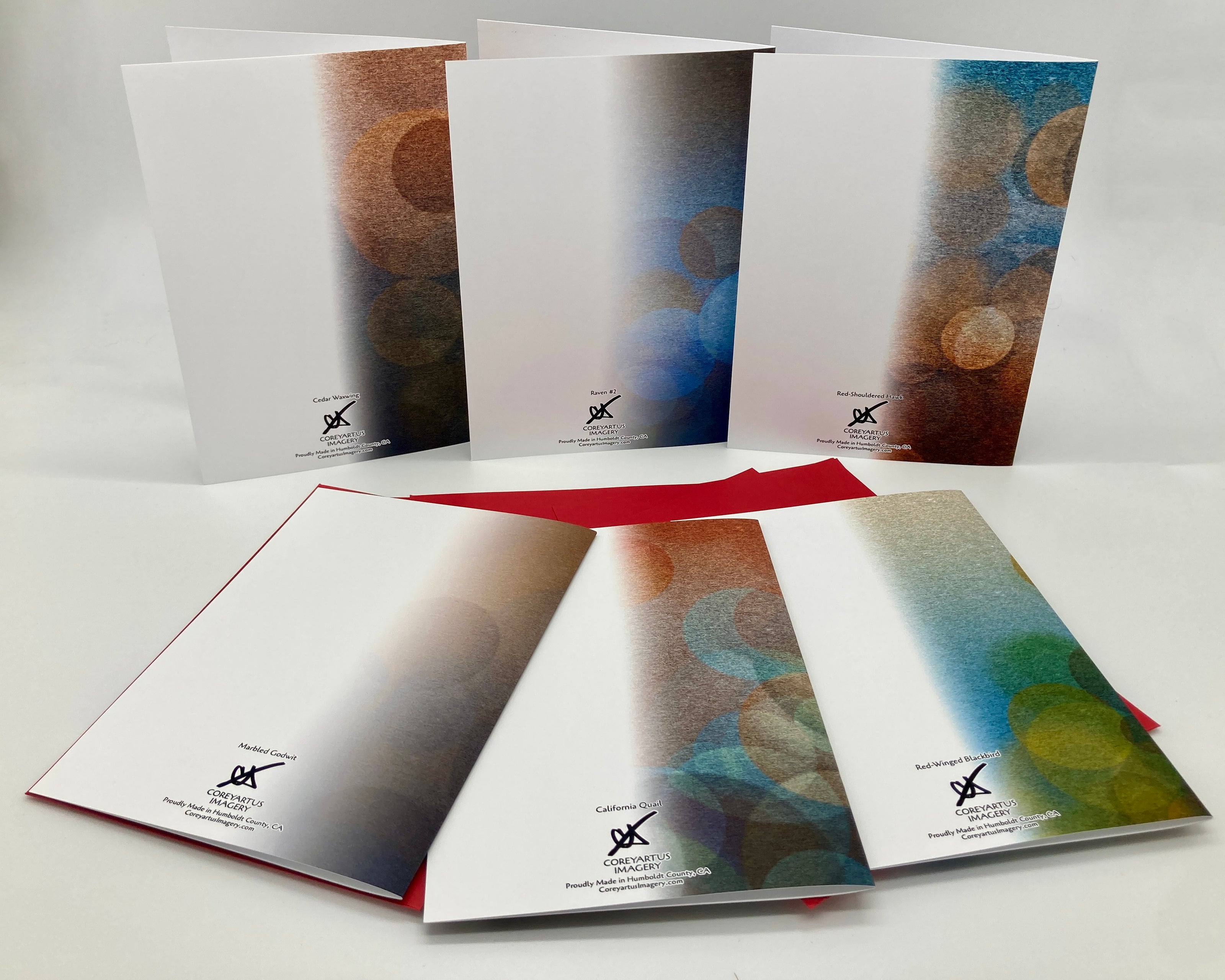 Backside of six greeting cards with abstract designs on a white background