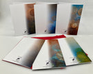 Backside of six greeting cards with abstract designs on a white background