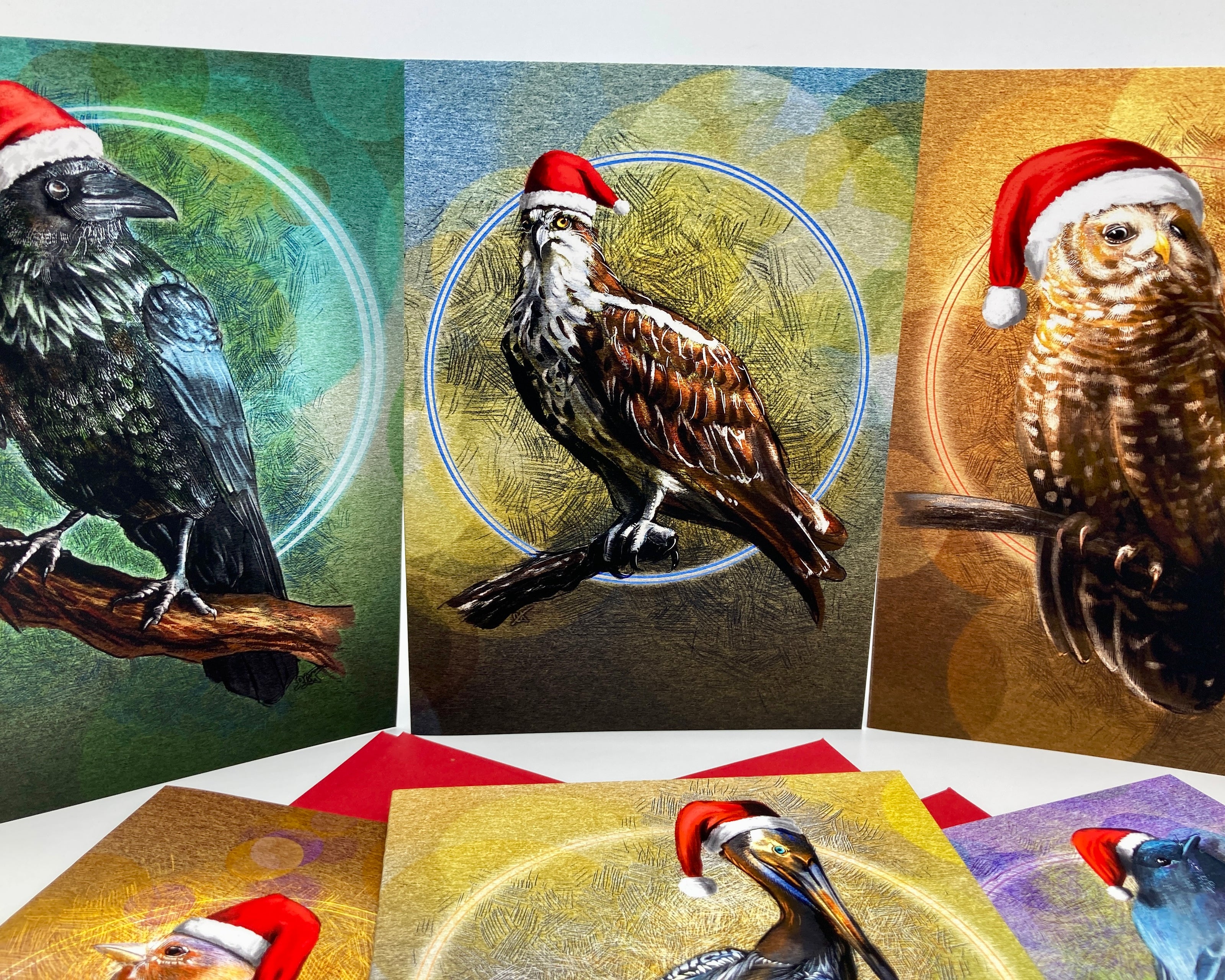 Set of greeting cards with birds wearing Santa hats on a white background