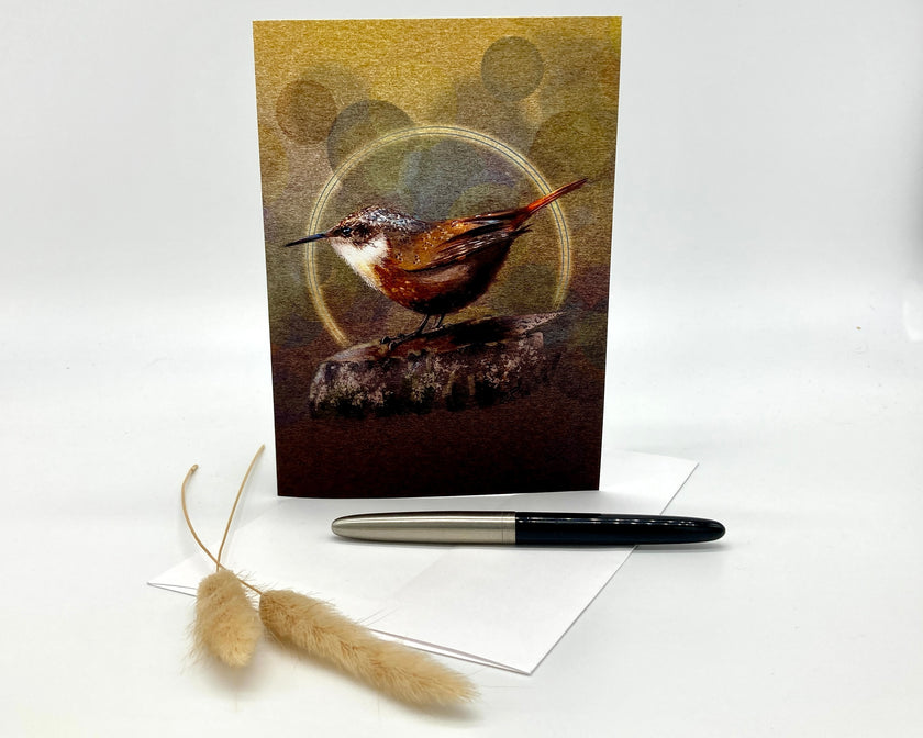 Greeting card with a bird design on a white background with a pen and decorative item.