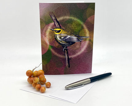 Greeting card with a bird design, pen, and fruit on a white background