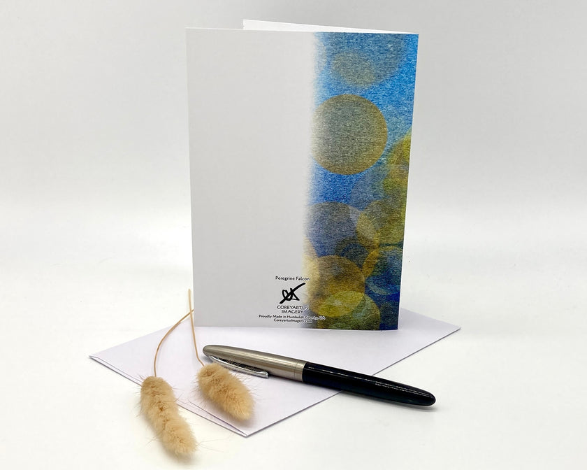 Greeting card with abstract design, pen, and decorative elements on a white background