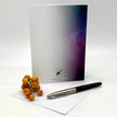 Greeting card with a pen and grapes on a white background