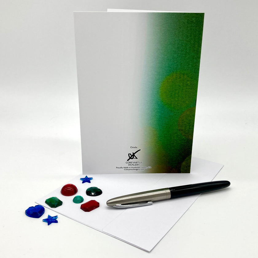 Card with green gradient design, pen, and color swatches on a white background