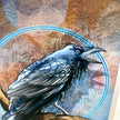 A close-up of a detailed bird illustration or print showing a black raven with blue-gray feathers, perched on a branch against a textured brown and beige background with a blue circular outline.