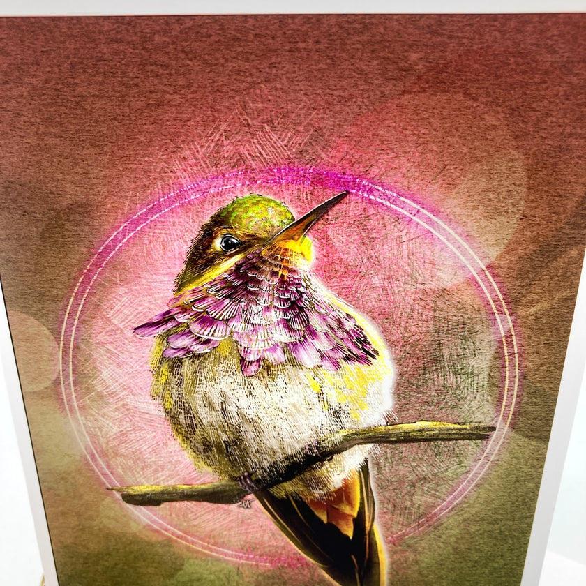 A close-up of a textured art print or painting depicting a hummingbird perched on a branch, with a pink circular glow and brushstroke background.