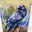 A detailed illustration of a raven perched on a tree stump, set against a textured gold and blue background with circular bokeh-like overlays.