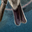 A closeup of a print featuring a Lazuli Bunting tail.