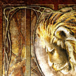 Decorative design with a lion's head and intricate patterns on a textured background