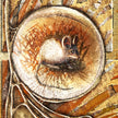 Decorative illustration of a mouse in a circular frame with intricate border design.