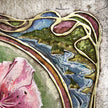 Decorative art piece with floral elements and wavy lines on a textured background