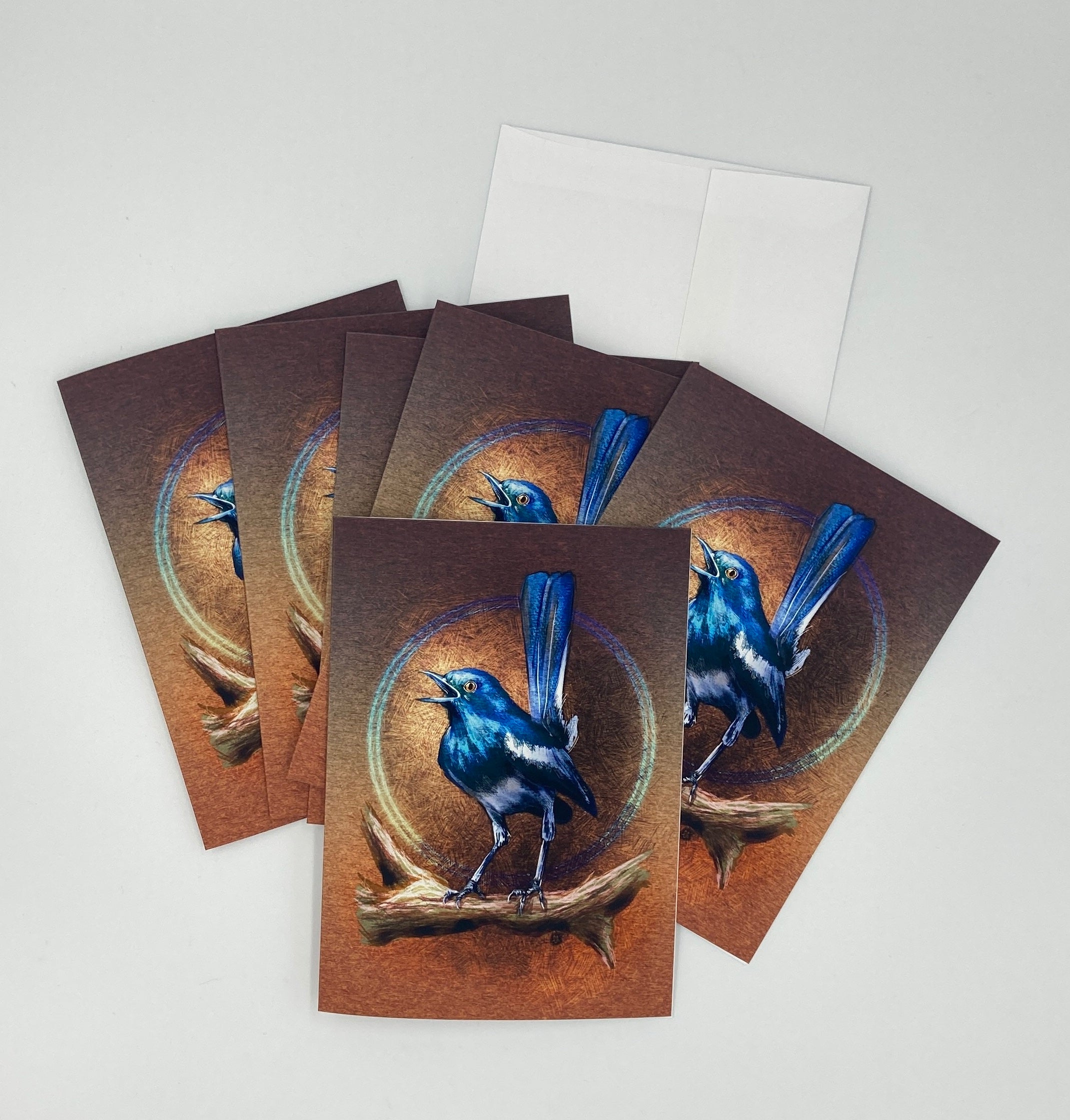 Set of greeting cards with blue bird illustration on brown backgrounds
