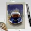 Greeting card with a blue teacup illustration on a beige background