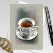 Greeting card with a teacup illustration on a textured surface