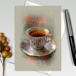 Greeting card with a teacup design on a textured surface
