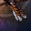 Close-up of a bird's tail feathers on a textured background