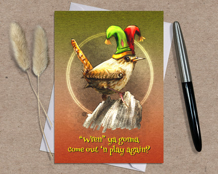 Greeting card with a wren wearing a jester hat on a brown background. Text says 