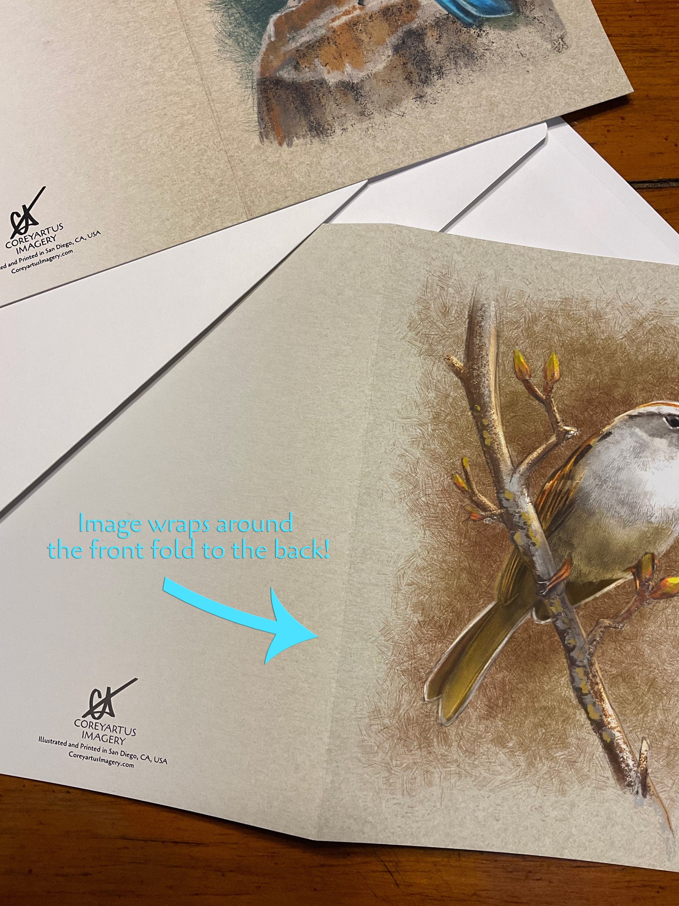 Card with a bird illustration on a wooden surface