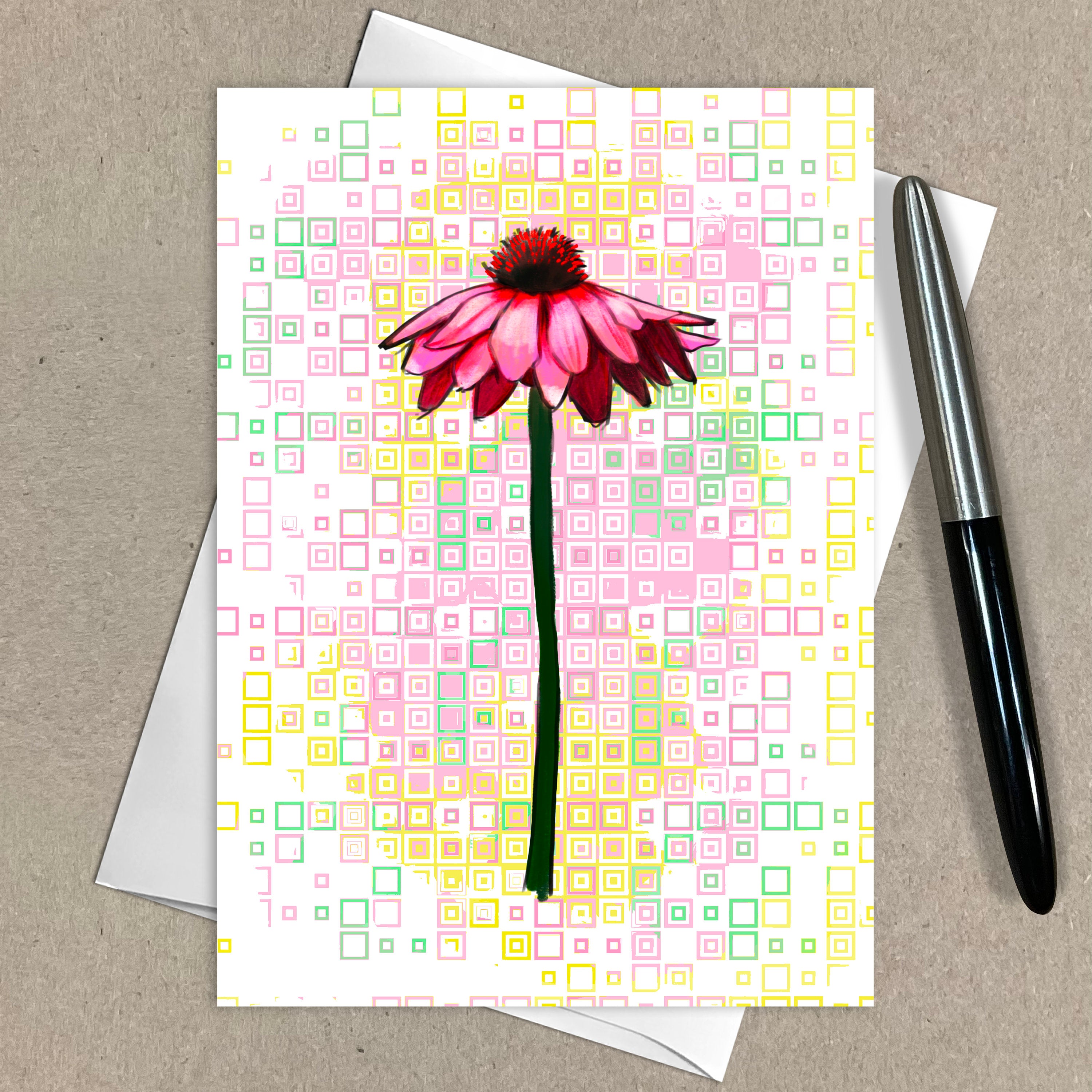 Greeting card with pink flower design on a patterned background, accompanied by a pen.