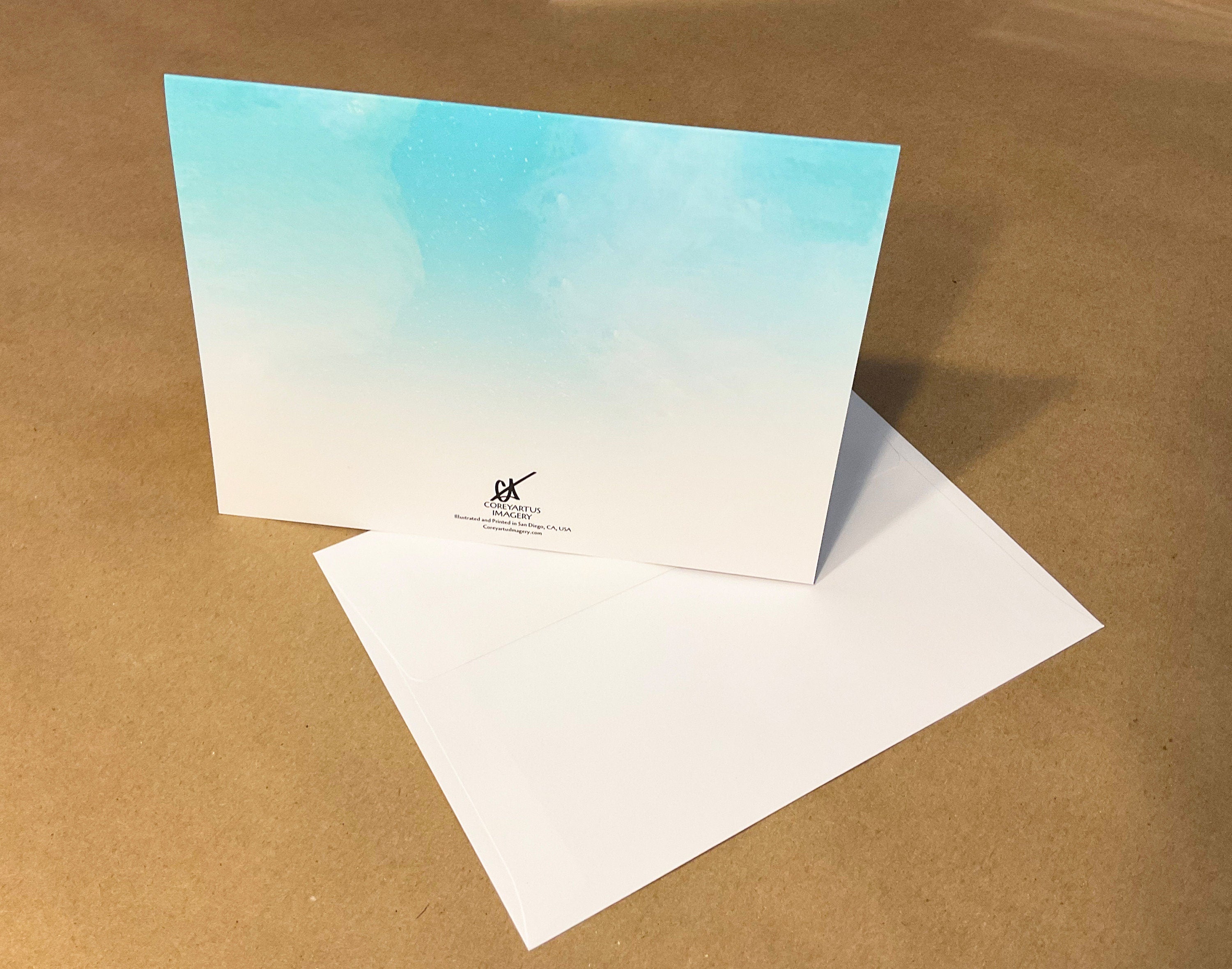 Greeting card with a gradient design on a brown surface