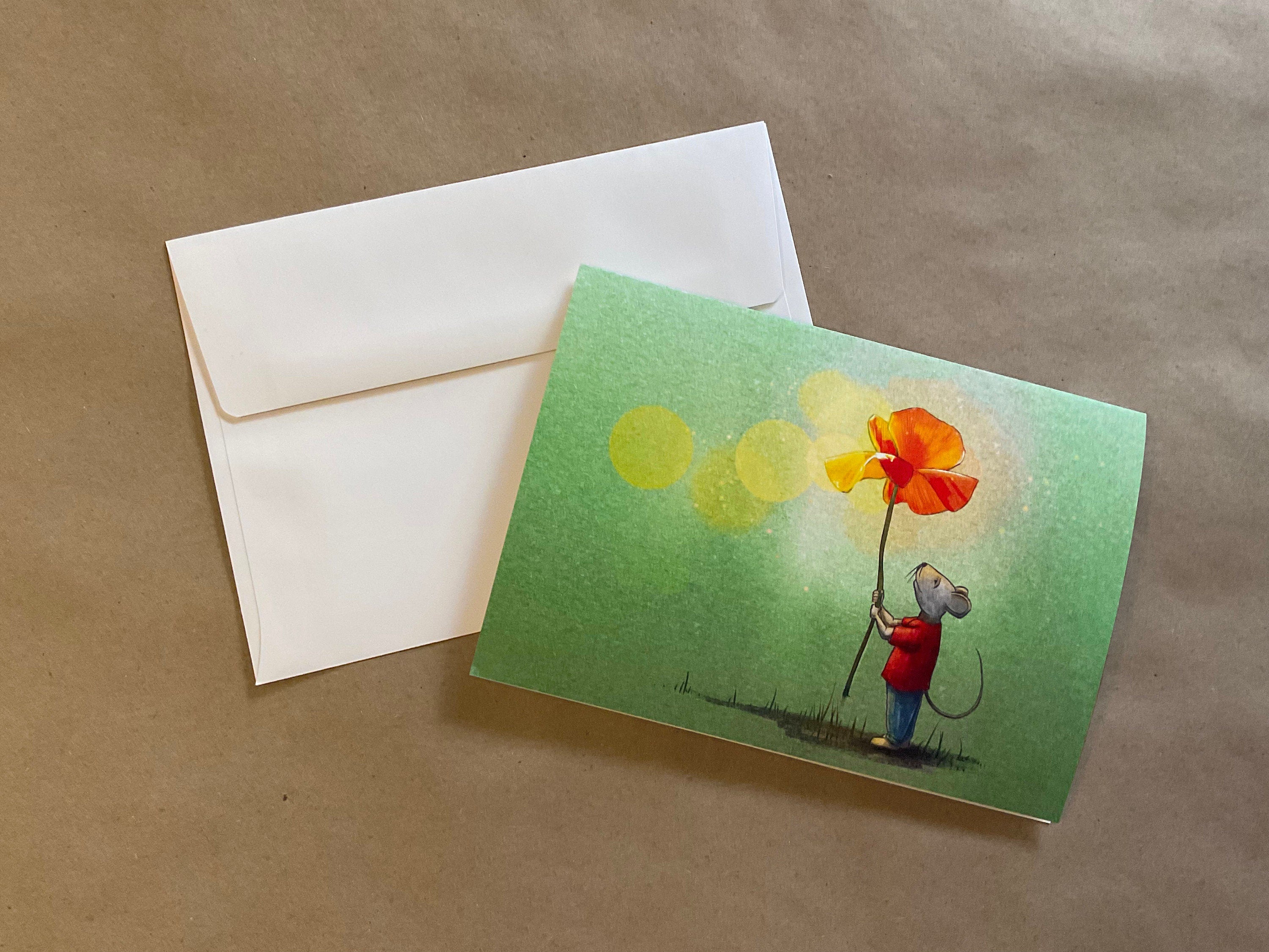 Greeting card with a mouse holding a flower and an envelope on a brown background