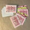 Set of floral greeting cards and envelopes on a brown background