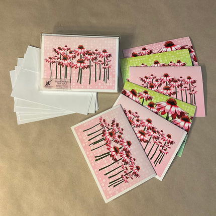 Set of floral greeting cards and envelopes on a brown background