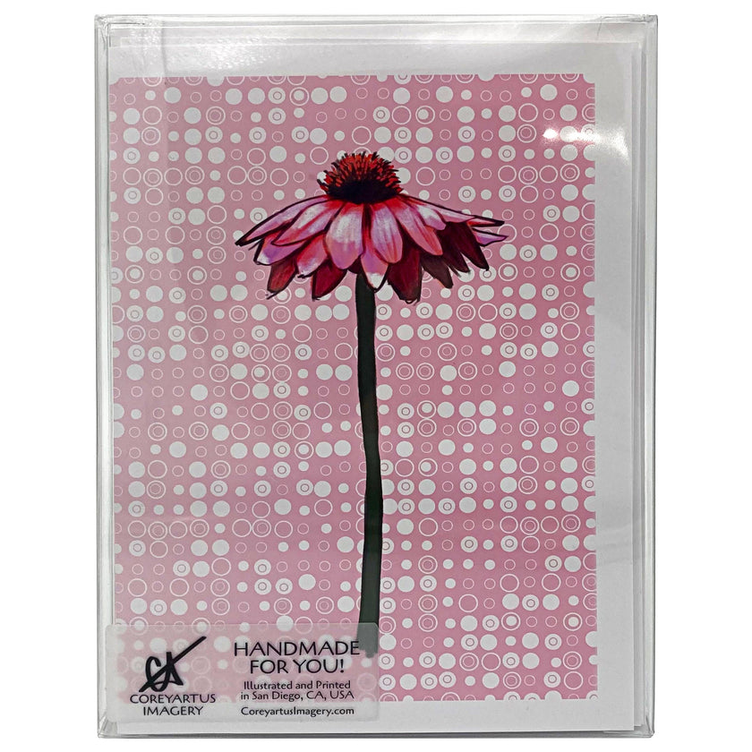 Card with a pink flower design on a patterned background, in a clear plastic case.