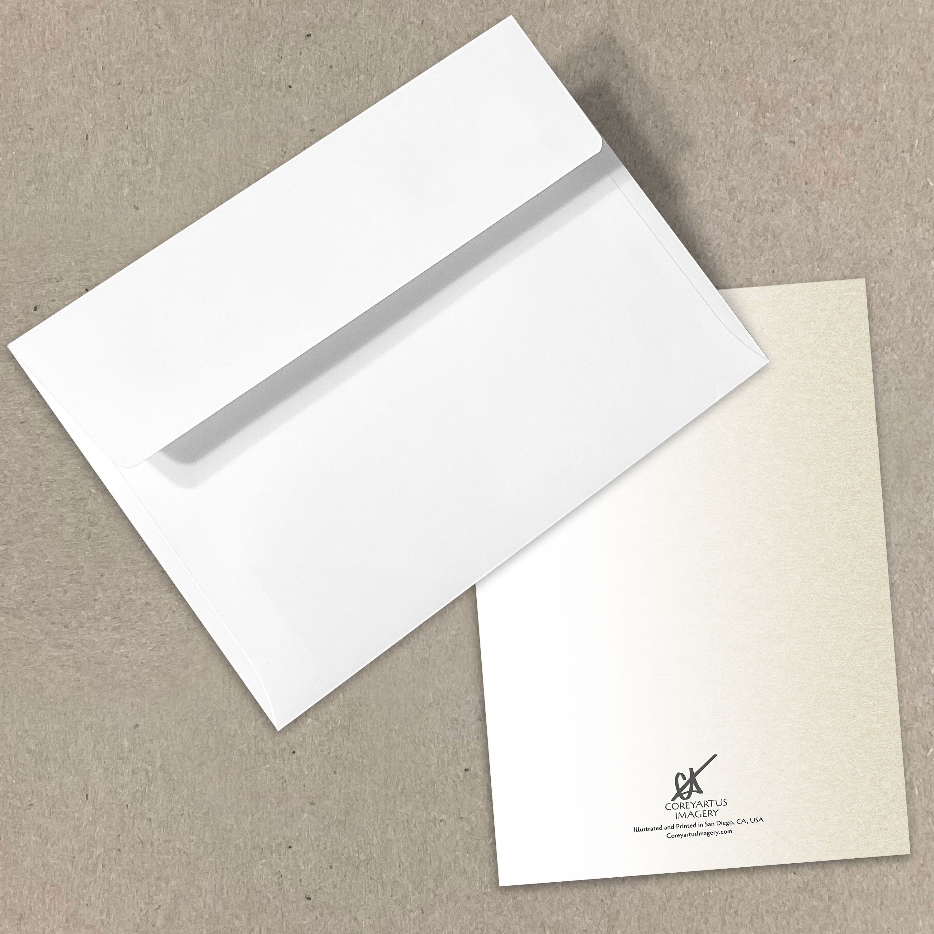 White envelope and card with a visible brand logo on a beige background