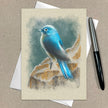 Greeting card with a blue bird illustration on a beige background