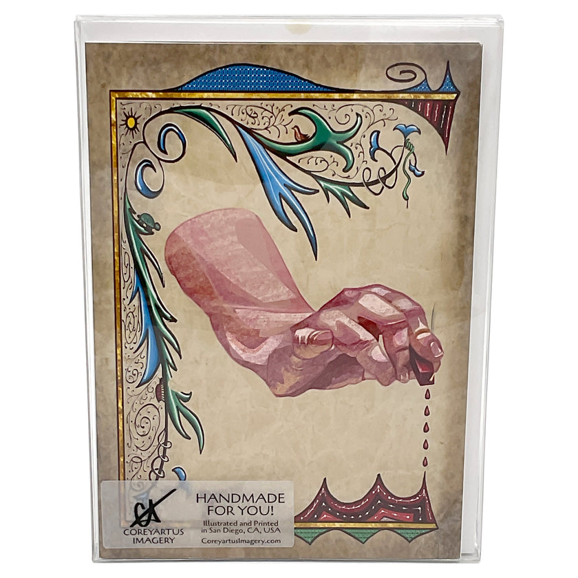 Decorative card with a hand and dripping wax design, packaged in a clear plastic box.